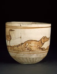 Cup decorated in red with a scene of two crocodiles with birds on their tails, 101-300